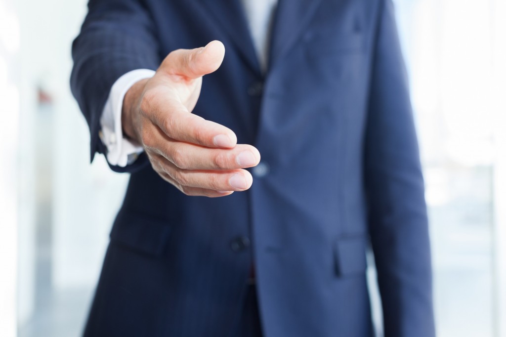 Close-up of a businessman offering an handshake